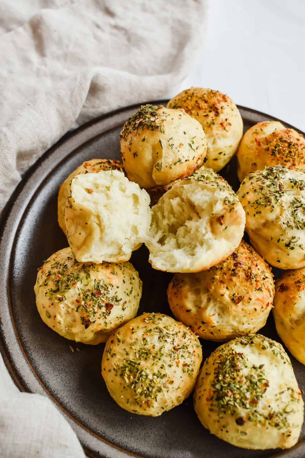 this is a close up of my high protein bagel bites with one of the breads opened up to show the soft pillowy middle.