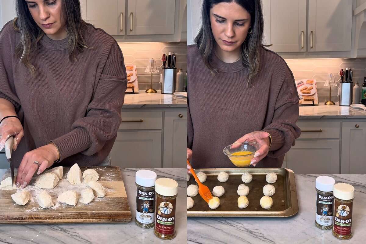 this shows me cutting the dough with the kitchen scrapers to make 16 equal dough parts and then rolled the dough and placed it on to a baking sheet.
