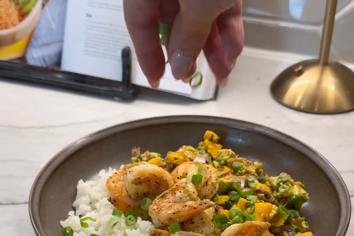 this shows me assembling the bowl and then adding green onions.