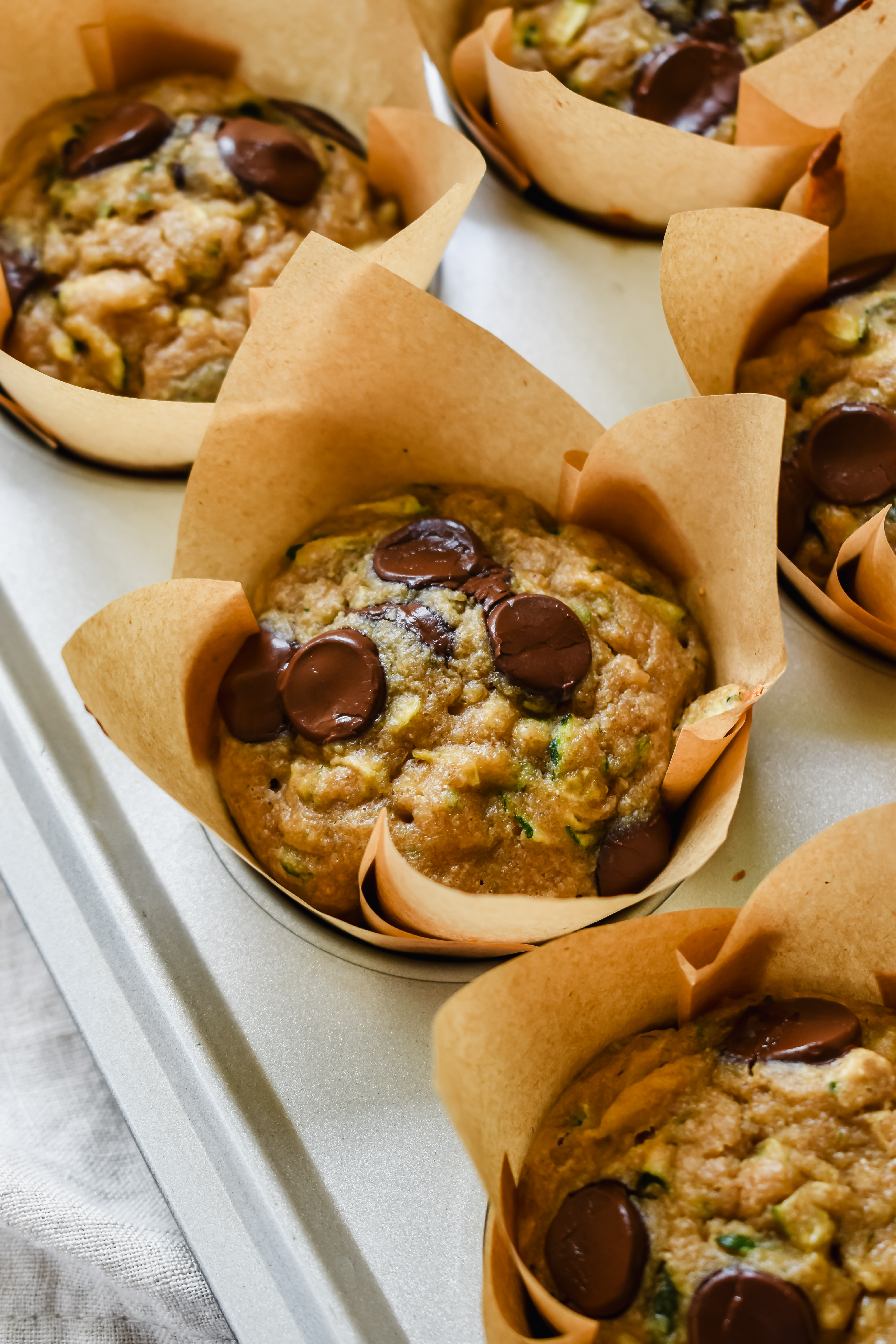 this is a close up of my almond flour zucchini muffins with chocolate chips in the pan.