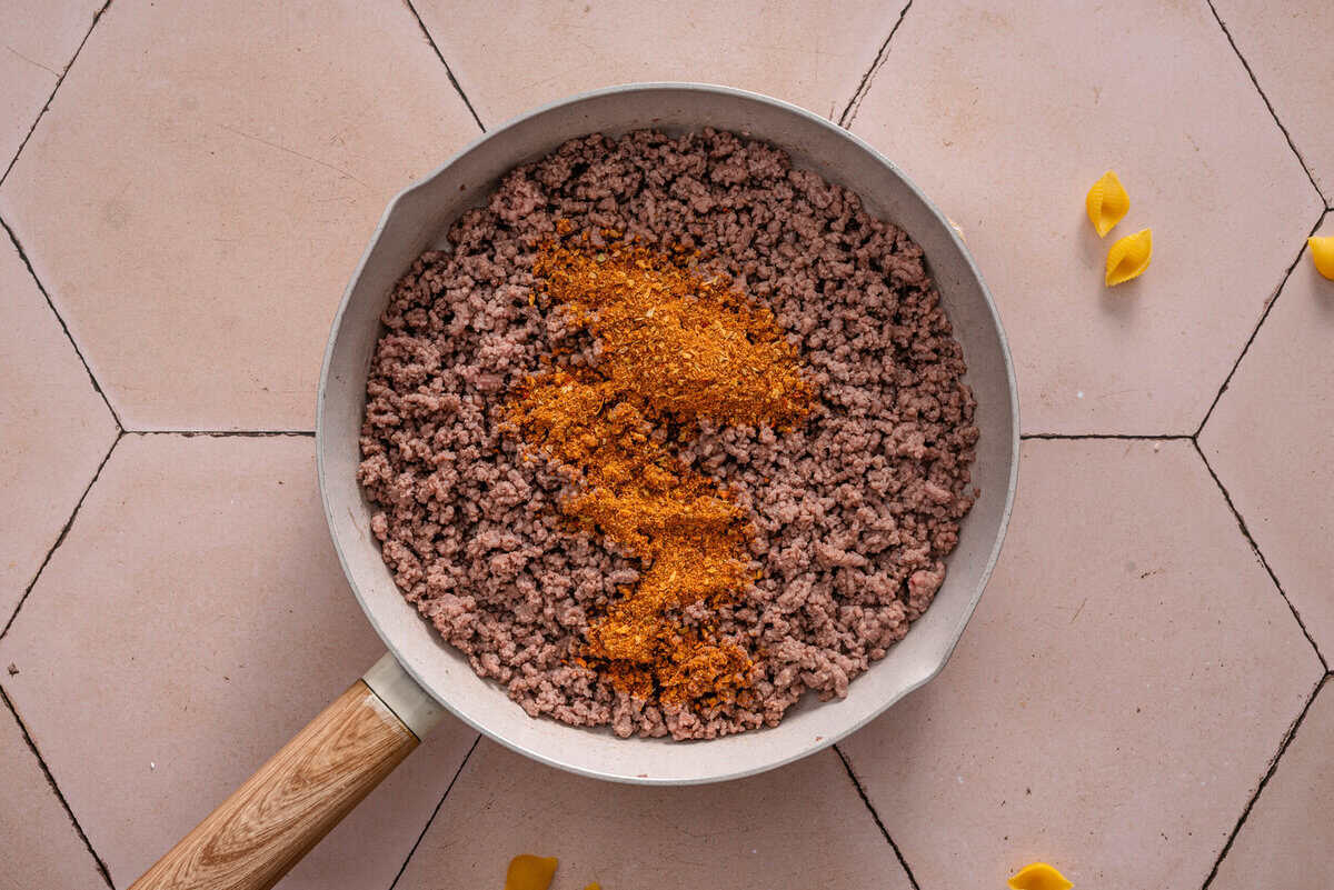 cooking the ground beef and seasoning
